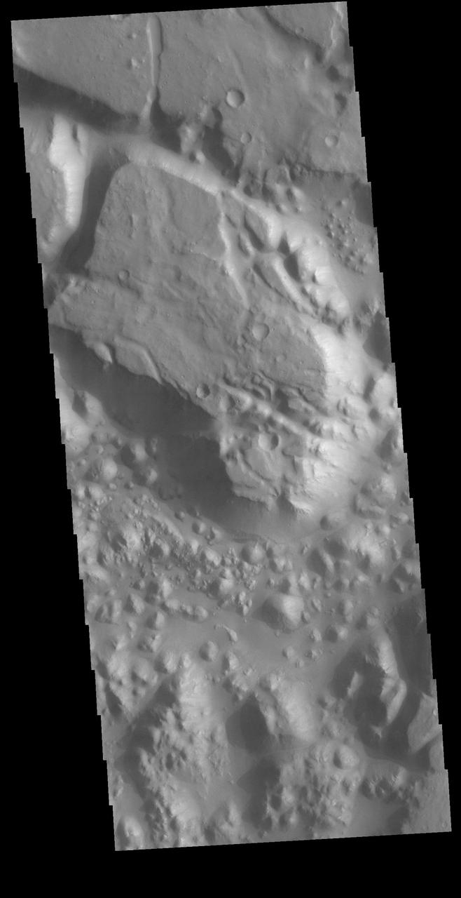 This VIS image shows a small section on Margaritifer Chaos. The term chaos is applied to regions where the surface is being eroded to form mesas. As the surface processes continue individual mesas become more isolated and take on the appearance of regions of hills. At the top of the image is Margaritifer Terra, which is being dissected into large mesas. Towards the bottom of the image the mesas have been eroded into smaller hills.  Orbit Number: 72315 Latitude: -8.86121 Longitude: 339.105 Instrument: VIS Captured: 2018-04-03 14:28  https://photojournal.jpl.nasa.gov/catalog/PIA22538