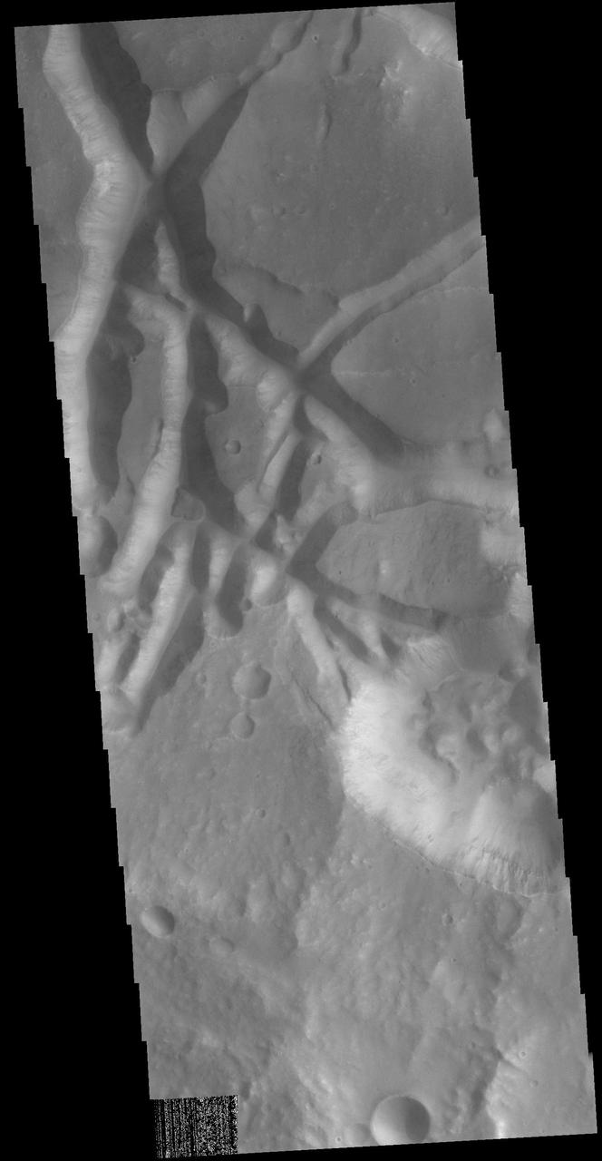 In this VIS image the surface region is being dissected by linear valleys. As the dissection continues individual mesas will develop, creating the terrain called chaos. The linear nature of the valleys is most likely due to tectonic fractures. In this region of Aram Chaos the mesas are still large, with time the mesa edges will continue to erode and the mesas will become smaller and further from each other. [Data is missing from the lower left-hand portion of the image.]  Orbit Number: 72315 Latitude: 0.732378 Longitude: 337.835 Instrument: VIS Captured: 2018-04-03 14:31  https://photojournal.jpl.nasa.gov/catalog/PIA22539