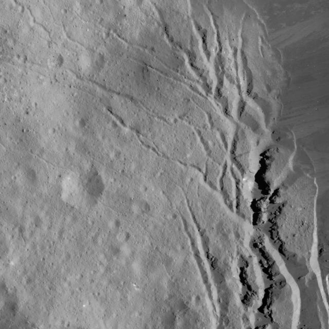 This image of Occator Crater's southeastern wall and floor was obtained by NASA's Dawn spacecraft on June 17, 2018 from an altitude of about 22 miles (36 kilometers). The center of this picture is located at about 17.4 degrees north latitude and 243.8 degrees east longitude. https://photojournal.jpl.nasa.gov/catalog/PIA22551
