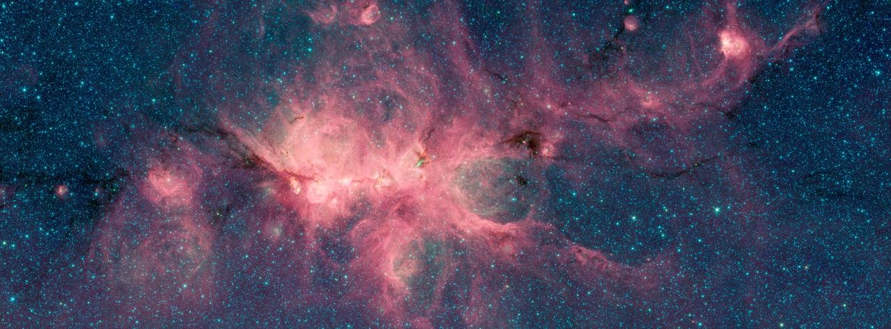 The Cat's Paw Nebula, imaged here by NASA's Spitzer Space Telescope, is a star-forming region inside the Milky Way Galaxy and is located in the constellation Scorpius. Its distance from Earth is estimated to be between 1.3 kiloparsecs (about 4,200 light years) to 1.7 kiloparsecs (about 5,500 light years).  The image was taken as part of the Galactic Legacy Infrared Midplane Survey Extraordinaire (GLIMPSE), a survey of the Milky Way Galaxy. It was taken using Spitzer's Infrared Array Camera (IRAC). The colors correspond with wavelengths of 3.6 microns (blue), 4.5 microns (green), and 8 microns (red).  The bright, cloudlike band running left to right across the image shows the presence of gas and dust that can collapse to form new stars. The black filaments running through the nebula are particularly dense regions of gas and dust. The entire star-forming region is thought to be between 24 and 27 parsecs (80-90 light years) across. New stars may heat up the pressurized gas surrounding them causing the gas to expand and form "bubbles."  https://photojournal.jpl.nasa.gov/catalog/PIA22567