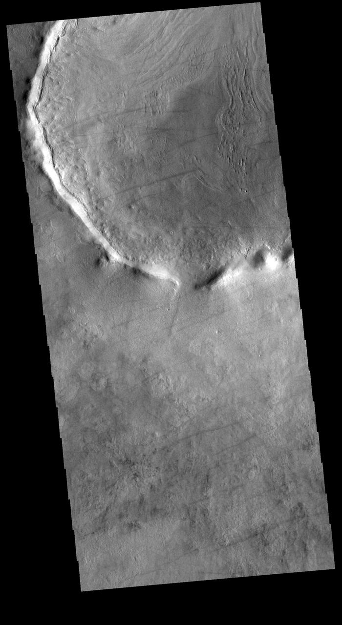 Today's VIS image shows dust devil tracks in Utopia Planitia. The tracks occur where dust devils have scoured the fine materials off the underlying surface. In some cases dust devils can create arced tracks. The ones in this image are mostly linear. Orbit Number: 72335 Latitude: 51.4292 Longitude: 112.722 Instrument: VIS Captured: 2018-04-05 06:20 https://photojournal.jpl.nasa.gov/catalog/PIA22578