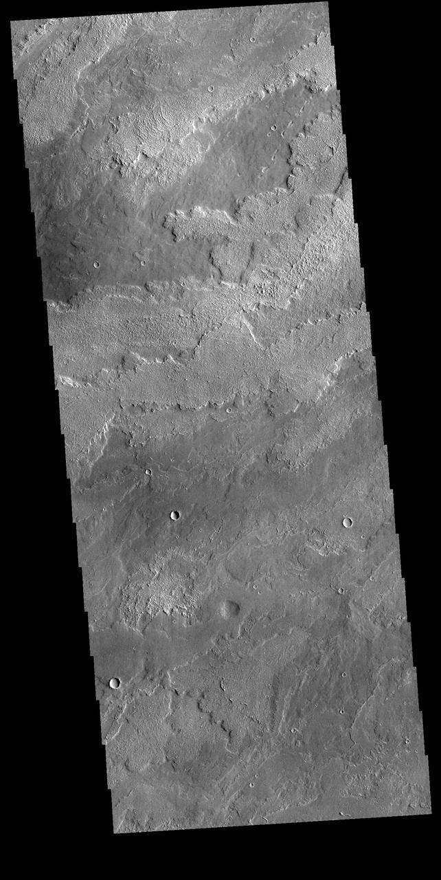 he lava flows in this VIS image originate at Arsia Mons. Arsia Mons in the southermost of the three large Tharsis volcanoes.  Orbit Number: 72406 Latitude: -19.4934 Longitude: 234.097 Instrument: VIS Captured: 2018-04-11 02:19  https://photojournal.jpl.nasa.gov/catalog/PIA22597