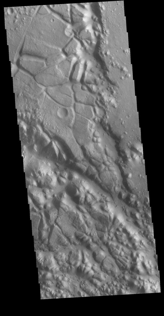 This VIS image shows part of Aram Chaos. Aram Chaos was initially formed by a large impact. Over time the crater interior was modified by several different processes, including liquid water. Located near Ares Vallis, a narrow channel links the Aram Chaos crater with Ares Vallis indicating a substantial amount of water was located in the crater. Chaos forms from erosion of the surface into mesa features. With time the valleys expand creating the jumble of hills seen in the image. Orbit Number: 72502 Latitude: 3.92429 Longitude: 340.169 Instrument: VIS Captured: 2018-04-19 00:14 https://photojournal.jpl.nasa.gov/catalog/PIA22624