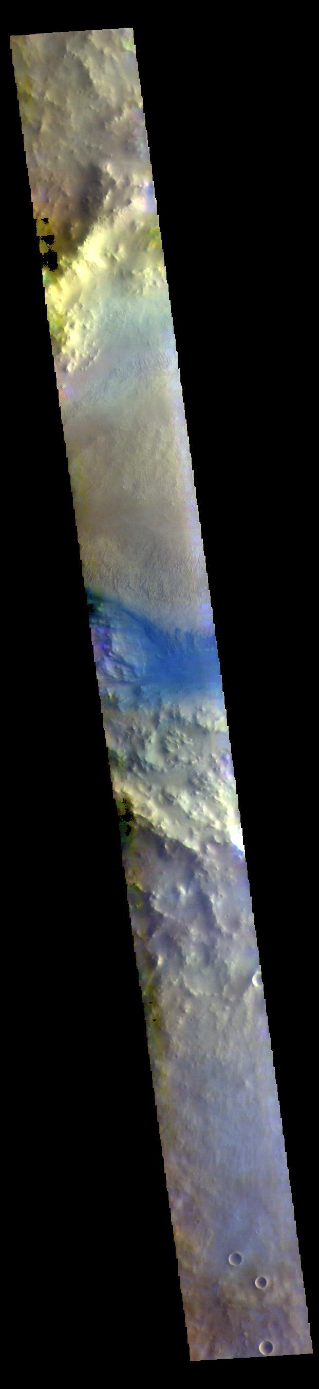 Part of a large crater fills the center of this VIS image. In this false color image the dark blue material is basaltic sand. The sands are located between the crater rim and a large mound of material on the floor of the crater.  The THEMIS VIS camera contains 5 filters. The data from different filters can be combined in multiple ways to create a false color image. These false color images may reveal subtle variations of the surface not easily identified in a single band image.  Orbit Number: 60626 Latitude: 1.14687 Longitude: 26.4337 Instrument: VIS Captured: 2015-08-14 16:43  https://photojournal.jpl.nasa.gov/catalog/PIA22712