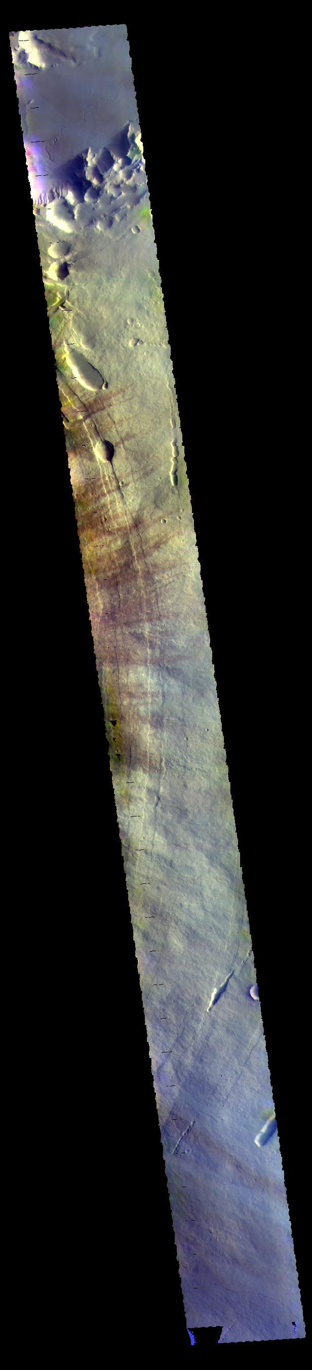 This VIS image shows the eastern flank of Pavonis Mons. The darker streaks are created by wind action.  The THEMIS VIS camera contains 5 filters. The data from different filters can be combined in multiple ways to create a false color image. These false color images may reveal subtle variations of the surface not easily identified in a single band image.  Orbit Number: 61080 Latitude: 1.34334 Longitude: 249.058 Instrument: VIS Captured: 2015-09-21 01:59  https://photojournal.jpl.nasa.gov/catalog/PIA22779
