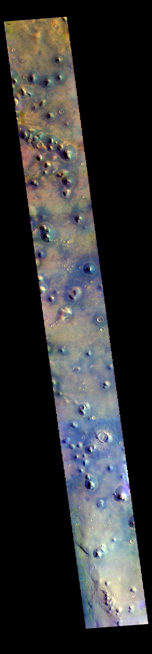 This VIS image shows some of the plains of Arcadia Planitia. Isolated small hills are a common feature in this part of the planitia.  The THEMIS VIS camera contains 5 filters. The data from different filters can be combined in multiple ways to create a false color image. These false color images may reveal subtle variations of the surface not easily identified in a single band image.  Orbit Number: 61382 Latitude: 37.5959 Longitude: 171.296 Instrument: VIS Captured: 2015-10-15 23:03  https://photojournal.jpl.nasa.gov/catalog/PIA22791