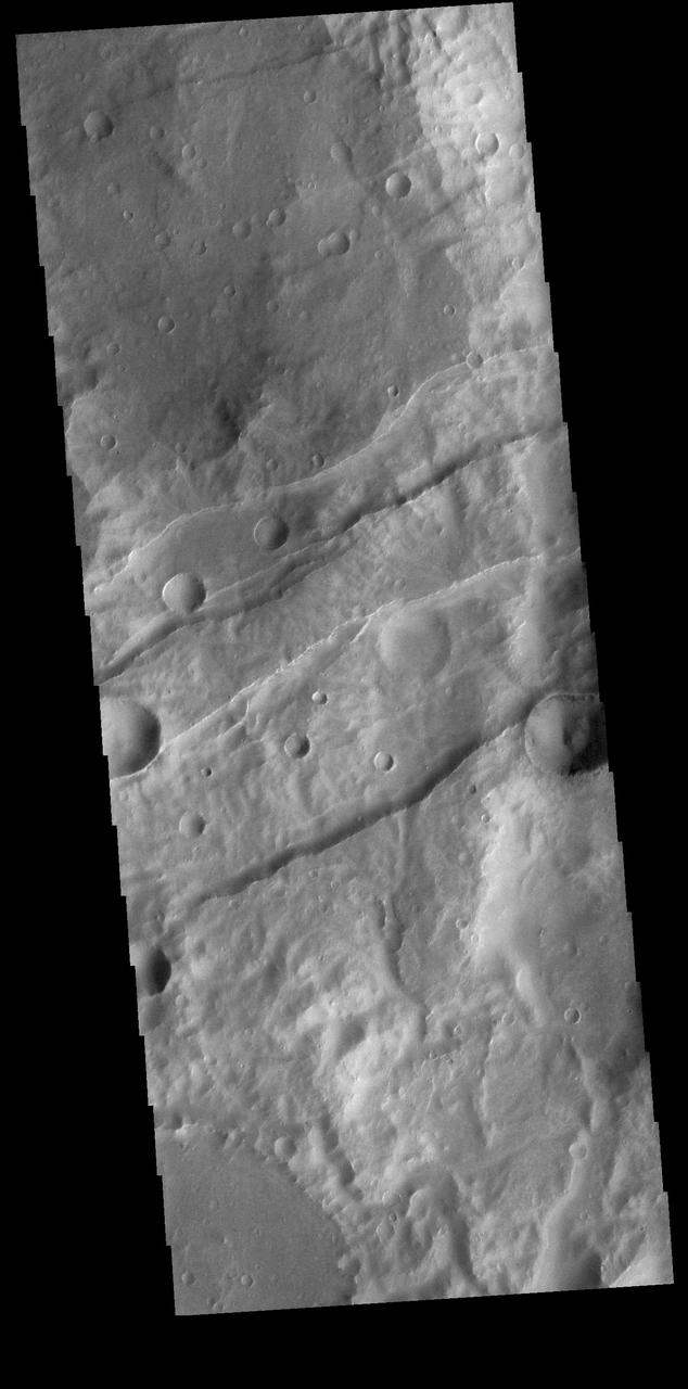 This VIS image shows a section of Sirenum Fossae. The linear features are called graben. Graben are formed by blocks of material sliding downward between pairs of faults. Orbit Number: 74365 Latitude: -28.1401 Longitude: 215.795 Instrument: VIS Captured: 2018-09-19 11:11 https://photojournal.jpl.nasa.gov/catalog/PIA22802
