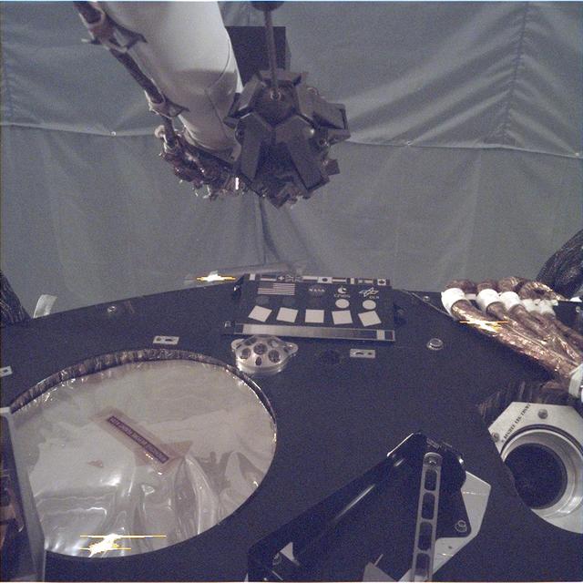 This image of the deck of NASA's InSight lander - where the camera's rectangular calibration target can be seen in the middle - was taken by the Instrument Deployment Camera during the assembly, test and launch operations phase at Lockheed Martin Space, Denver. The Instrument Deployment Camera is attached to the spacecraft's robotic arm. For more on the calibration target see https://photojournal.jpl.nasa.gov/catalog/PIA22540. https://photojournal.jpl.nasa.gov/catalog/PIA22815