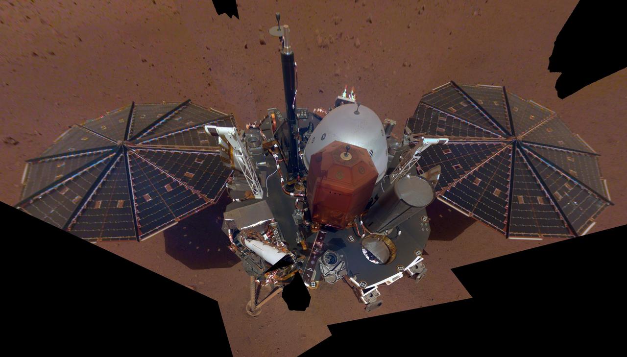 This is NASA InSight's first full selfie on Mars. It displays the lander's solar panels and deck. On top of the deck are its science instruments, weather sensor booms and UHF antenna. The selfie was taken on Dec. 6, 2018 (Sol 10).  The selfie is made up of 11 images which were taken by its Instrument Deployment Camera, located on the elbow of its robotic arm. Those images are then stitched together into a mosaic.  https://photojournal.jpl.nasa.gov/catalog/PIA22876