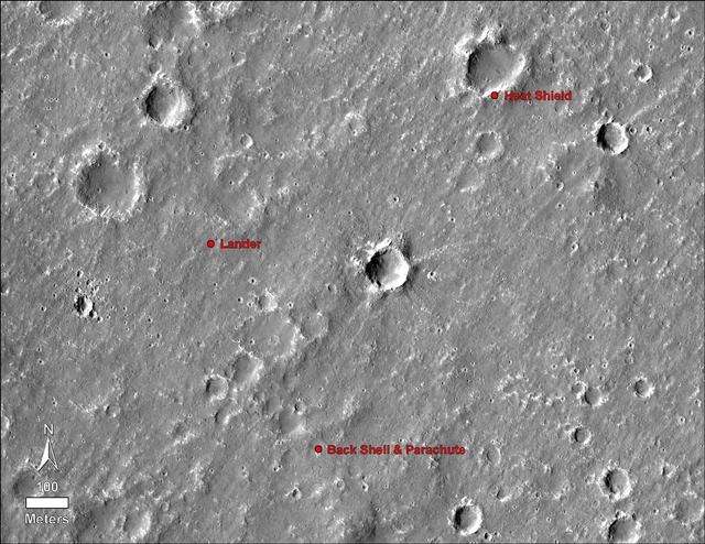 An annotated image of the surface of Mars, taken by the HiRISE camera on NASA's Mars Reconnaissance Orbiter (MRO) on May 30, 2014. The annotations - added after InSight landed on Nov. 26, 2018 - display the locations of NASA's InSight lander, its heat shield and parachute.  https://photojournal.jpl.nasa.gov/catalog/PIA22877