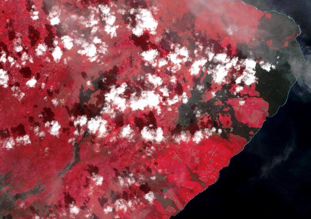 The 2018 Kilauea, Hawaii eruption began in May on Kilauea's East Rift Zone. Lava fountains up to 100 meters high, lava flows, and volcanic gas continued until August. By the time the eruption ended, over 700 houses had been destroyed, and 35 square kilometers of land had been covered by lava flows. About 3.5 square kilometers (875 acres) of new land has been created in the ocean. The before image was acquired by Landsat 8 on September 5, 2013; the ASTER image was acquired November 14, 2018. The images cover an area of 18 by 25.5 kilometers, and are located at 19.5 degrees north, 154.9 degrees west.  https://photojournal.jpl.nasa.gov/catalog/PIA22899