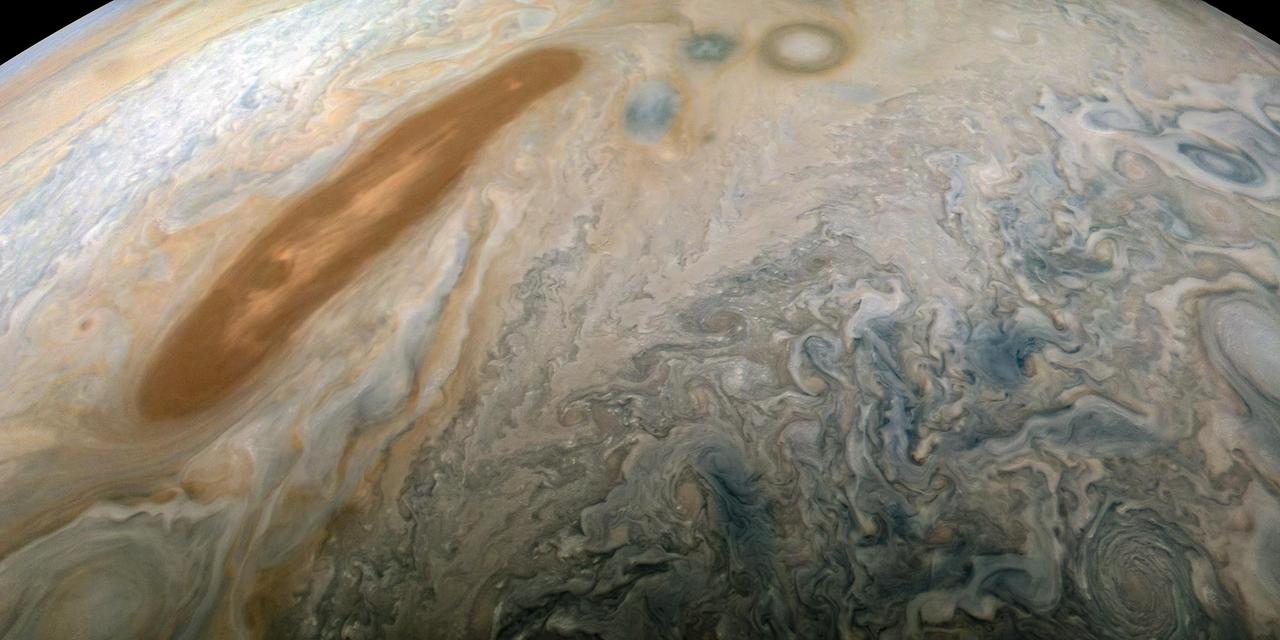 A long, brown oval known as a "brown barge" in Jupiter's North North Equatorial Belt is captured in this color-enhanced image from NASA's Juno spacecraft.  This image was taken at 6:01 p.m. PDT (9:01 p.m. EDT) on Sept. 6, 2018, as the spacecraft performed its 15th close flyby of Jupiter.  Citizen scientist Kevin M. Gill created this image using data from the spacecraft's JunoCam imager. https://photojournal.jpl.nasa.gov/catalog/PIA22939. -    Enhanced image by Kevin M. Gill (CC-BY) based on images provided courtesy of NASA/JPL-Caltech/SwRI/MSSS