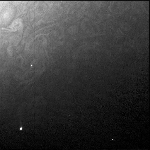 Juno's Radiation Monitoring Investigation used the Stellar Reference Unit (SRU) star camera to collect this high resolution image of the dark side of Jupiter during Perijove 11 on Feb. 7, 2018. The clouds are illuminated by moonlight from Jupiter's moon Io and the two bright spots are flashes of Jovian lightning. Juno was 41,000 miles (66,000 kilometers) from the cloud tops when this SRU image was collected. This is the closest view of Jupiter's lightning from a visible light camera to date.  https://photojournal.jpl.nasa.gov/catalog/PIA22964