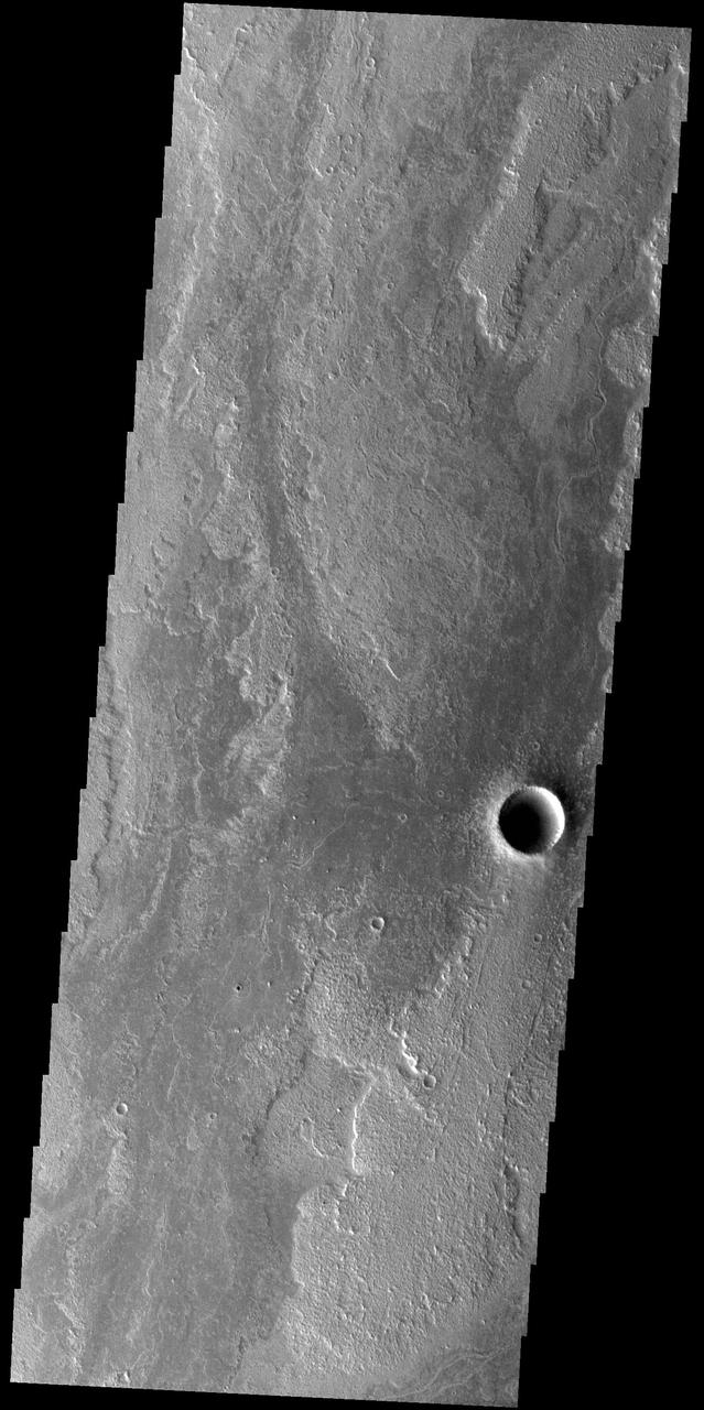 Today's VIS image shows a small portion of Daedalia Planum. The lava flows the comprise this large lava plain originated at Arsia Mons, one of the large Tharsis volcanoes.  Orbit Number: 74957 Latitude: -18.6281 Longitude: 239.478 Instrument: VIS Captured: 2018-11-07 04:43  https://photojournal.jpl.nasa.gov/catalog/PIA22986