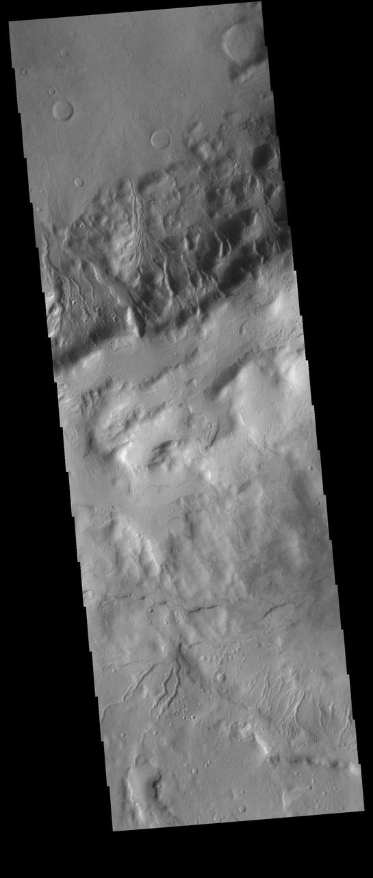 Multiple gullies dissect the rim of an unnamed crater located in Terra Sirenum. Towards the bottom of the image several small gullies are visible located on the rim of an older crater.  Orbit Number: 75238 Latitude: -45.5986 Longitude: 225.72 Instrument: VIS Captured: 2018-11-30 08:47  https://photojournal.jpl.nasa.gov/catalog/PIA23015