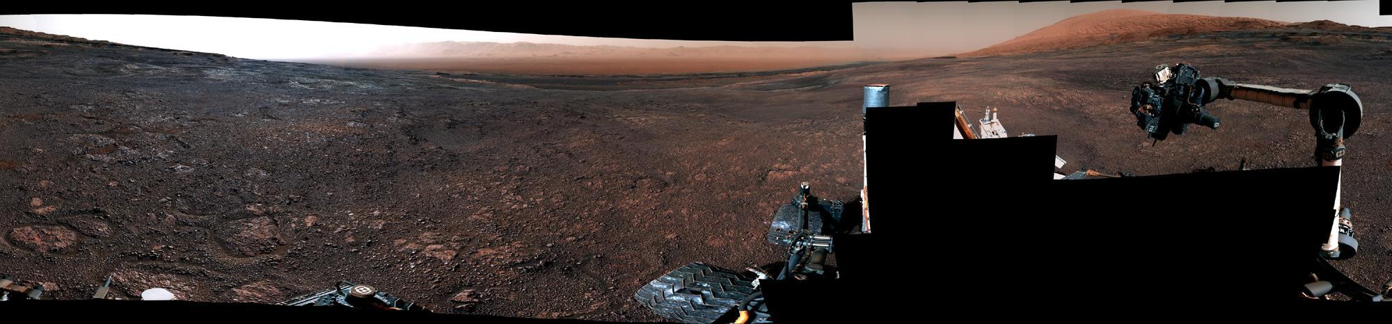 This panorama was taken on Dec. 19, 2018, (Sol 2265) by the Mast Camera (Mastcam) on NASA's Curiosity Mars rover. The rover's last drill location on Vera Rubin Ridge is visible, as well as the clay region it will spend the next year exploring.  The scene combines 122 images taken with Mastcam's left-eye camera. It is presented with a color adjustment that approximates white balancing to resemble how the rocks and sand would appear under daytime lighting conditions on Earth.  https://photojournal.jpl.nasa.gov/catalog/PIA23042
