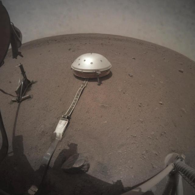 NASA's InSight lander took this series of images on Wednesday, March 6, 2019, capturing the moment when Phobos, one of Mars' moons, crossed in front of the Sun and darkened the ground around the lander. These images were taken by InSight's Instrument Context Camera (ICC), located under the lander's deck.  The images were taken at intervals of about 50 seconds in order to capture the eclipse, which on this day lasted 26.7 seconds. The shadow of the lander can be seen moving to the right before the entire scene darkened during the moment of the eclipse.  Movie available at https://photojournal.jpl.nasa.gov/catalog/PIA23048