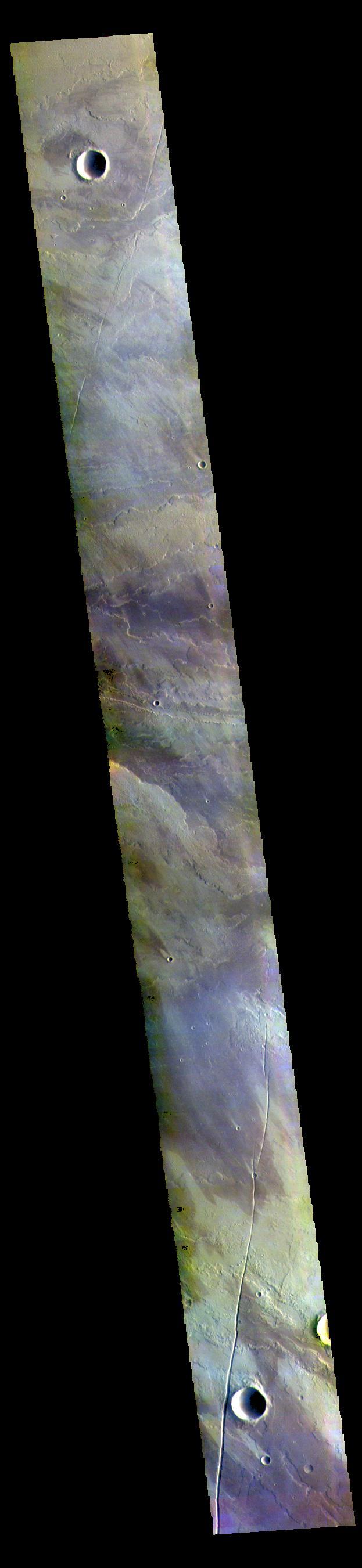 This VIS image shows a small part of the extensive volcanic plains located east of Olympus Mons.  The THEMIS VIS camera contains 5 filters. The data from different filters can be combined in multiple ways to create a false color image. These false color images may reveal subtle variations of the surface not easily identified in a single band image.  Orbit Number: 60918 Latitude: 20.5787 Longitude: 239.913 Instrument: VIS Captured: 2015-09-07 17:55  https://photojournal.jpl.nasa.gov/catalog/PIA23051