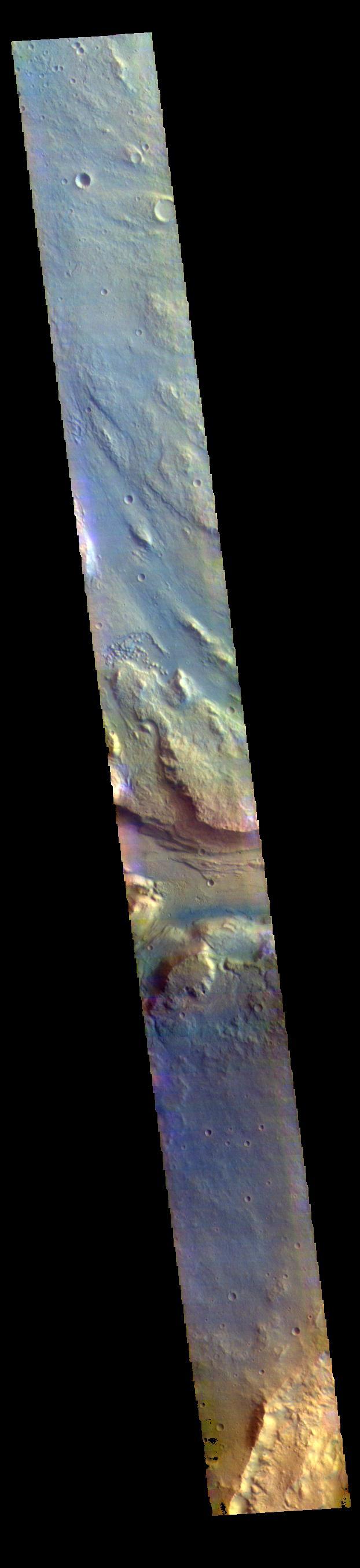 This false color image contains several channel features. Towards the top of the image are several stream-lined islands, created by liquid flow eroding preexisting rock. The islands have a tear-drop shape, with the pointy end down stream from the rounded end. In this case the fluid flowed from the bottom right of the frame towards the upper left. Just below the center of the image is a larger, deeper channel. All these channel features merge into Ares Vallis, a huge outflow channel that empties into Chryse Planitia.  The THEMIS VIS camera contains 5 filters. The data from different filters can be combined in multiple ways to create a false color image. These false color images may reveal subtle variations of the surface not easily identified in a single band image.  Orbit Number: 61501 Latitude: 4.31188 Longitude: 343.17 Instrument: VIS Captured: 2015-10-25 18:03  https://photojournal.jpl.nasa.gov/catalog/PIA23066