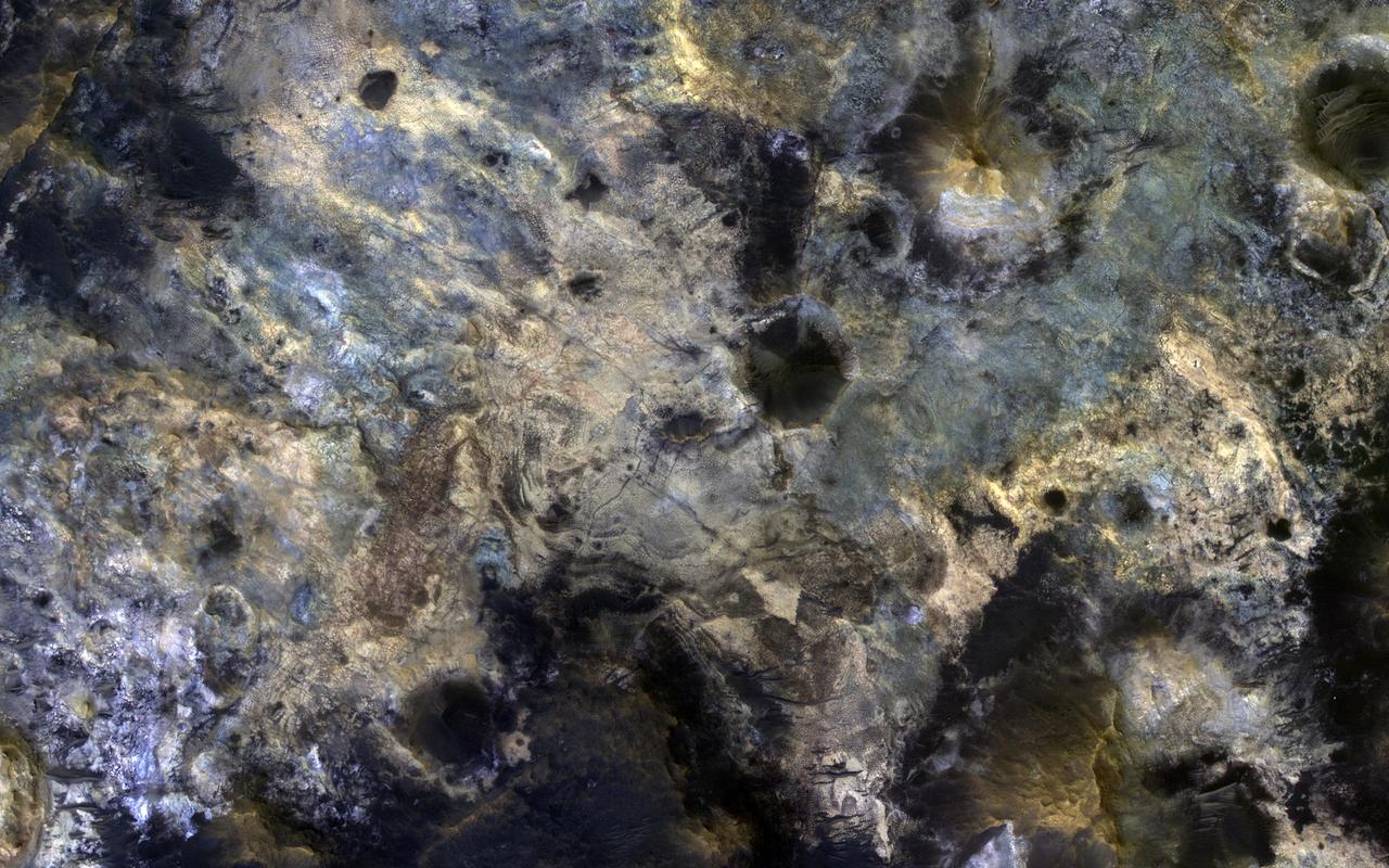 Mawrth Vallis is a place on Mars that has fascinated scientists because of the clays and other hydrated minerals detected from orbit.  In this image, the enhanced black colors are most likely basaltic sands and rocks, while the green, yellow, and blue colors correspond to the different hydrated minerals.  This particular image was taken of a location in Mawrth Vallis that has a mineral called jarosite. Jarosite on Earth forms under wet, oxidizing, and acidic conditions. Another place on Mars where the Opportunity rover landed and explored also has jarosite.  https://photojournal.jpl.nasa.gov/catalog/PIA23080