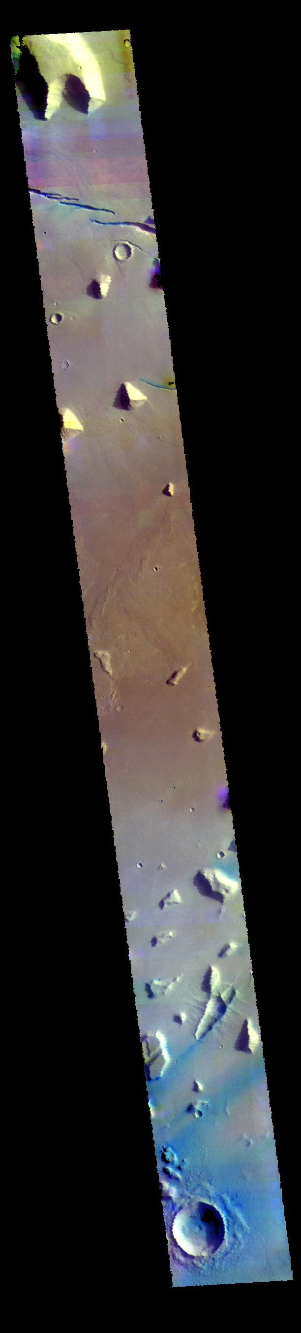 Today's VIS image is located in Elysium Planitia. The linear depressions at the top of the image are created by tectonic faults, where the center block of material has dropped downward between two parallel faults. Blue tones, like those at the bottom of the image, are indicative of basaltic sands.  The THEMIS VIS camera contains 5 filters. The data from different filters can be combined in multiple ways to create a false color image. These false color images may reveal subtle variations of the surface not easily identified in a single band image.  Orbit Number: 61919 Latitude: 14.9167 Longitude: 161.38 Instrument: VIS Captured: 2015-11-29 04:17  https://photojournal.jpl.nasa.gov/catalog/PIA23087
