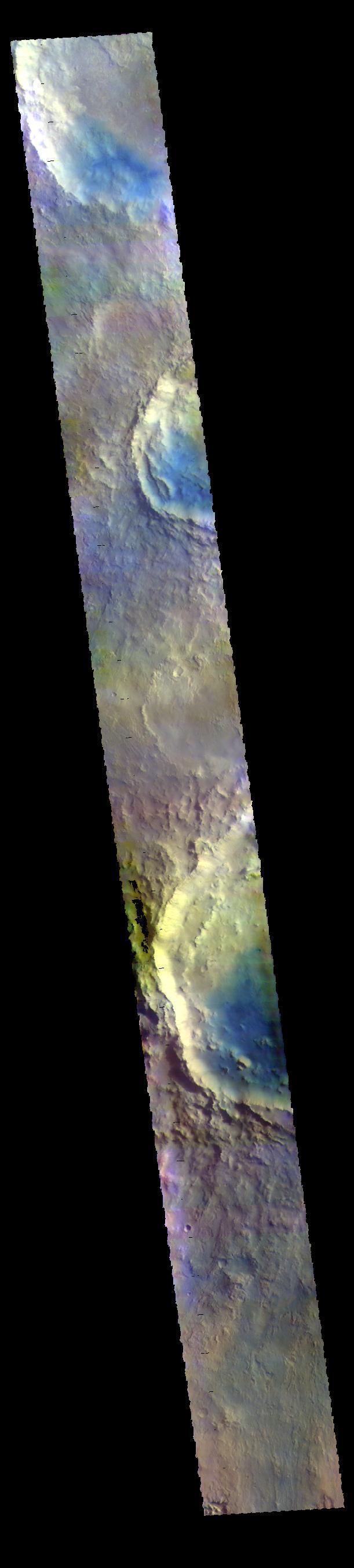 This VIS image shows parts of several craters located in Arabia Terra. Blue tones in false color images indicated the presence of basaltic sands.  The THEMIS VIS camera contains 5 filters. The data from different filters can be combined in multiple ways to create a false color image. These false color images may reveal subtle variations of the surface not easily identified in a single band image.  Orbit Number: 61900 Latitude: 9.88836 Longitude: 350.337 Instrument: VIS Captured: 2015-11-27 14:42  https://photojournal.jpl.nasa.gov/catalog/PIA23090