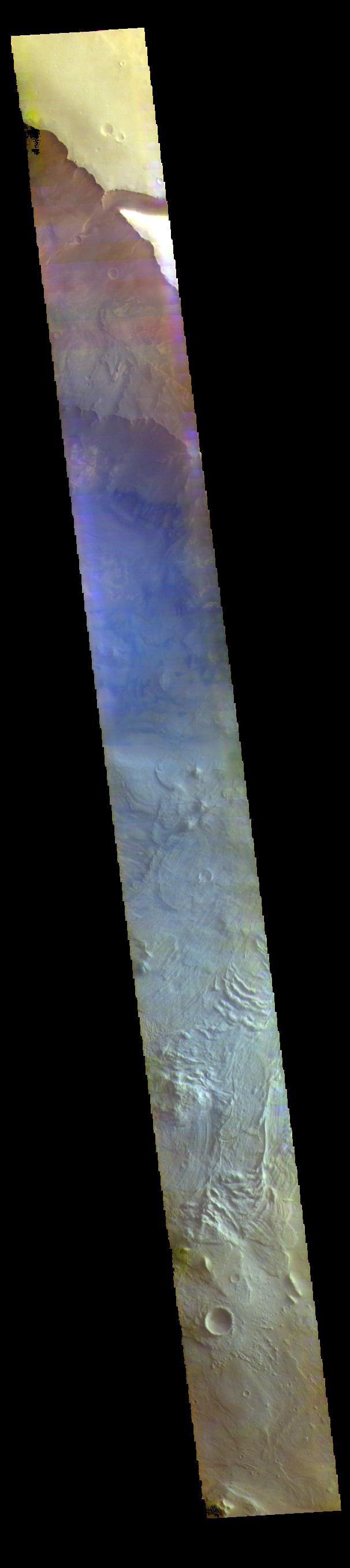 This false color image is located within Melas Chasma. The lobate forms at the bottom of the image are the remnants of landslides that crashed from the top of the cliff sides to the bottom of the chasma, a distance of 9km (5.5 miles). This distance is equivalent to the height of Mount Everest - the tallest land based mountain in the world.  The THEMIS VIS camera contains 5 filters. The data from different filters can be combined in multiple ways to create a false color image. These false color images may reveal subtle variations of the surface not easily identified in a single band image.  Orbit Number: 62002 Latitude: -10.1885 Longitude: 289.797 Instrument: VIS Captured: 2015-12-06 00:12  https://photojournal.jpl.nasa.gov/catalog/PIA23093