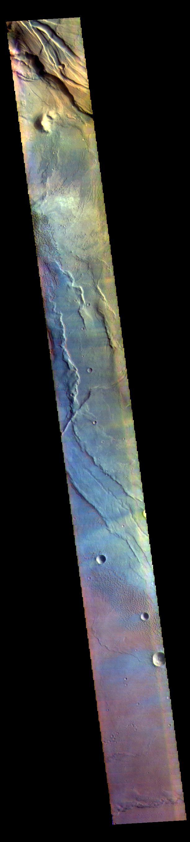 This VIS image is located in the center of Syrtis Major Planum. At the top of the image is Nili Patera, a volcanic summit. The sand dunes located near Nili Patera are visible on the left side of the image. The bottom of the image is just west of Meroe Patera. Dunes located between Nili and Meroe are visible towards the bottom of the image. Winds in the region have created the dunes, but also many windstreaks on the downward side of craters in the image. Wind streaks indicate the direction of the wind. In this region the winds are blowing from east to west.  The THEMIS VIS camera contains 5 filters. The data from different filters can be combined in multiple ways to create a false color image. These false color images may reveal subtle variations of the surface not easily identified in a single band image.  Orbit Number: 62072 Latitude: 7.99408 Longitude: 67.5512 Instrument: VIS Captured: 2015-12-11 18:39  https://photojournal.jpl.nasa.gov/catalog/PIA23095