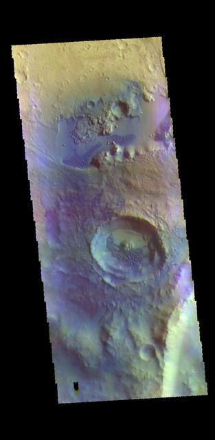 This VIS image is located in an unnamed crater in Arabia Terra. Dark blue tones in false color indicate basaltic sands. These sands have created the dunes seen in this image. The THEMIS VIS camera contains 5 filters. The data from different filters can be combined in multiple ways to create a false color image. These false color images may reveal subtle variations of the surface not easily identified in a single band image. Orbit Number: 62274 Latitude: 10.6037 Longitude: 358.441 Instrument: VIS Captured: 2015-12-28 09:57 https://photojournal.jpl.nasa.gov/catalog/PIA23109