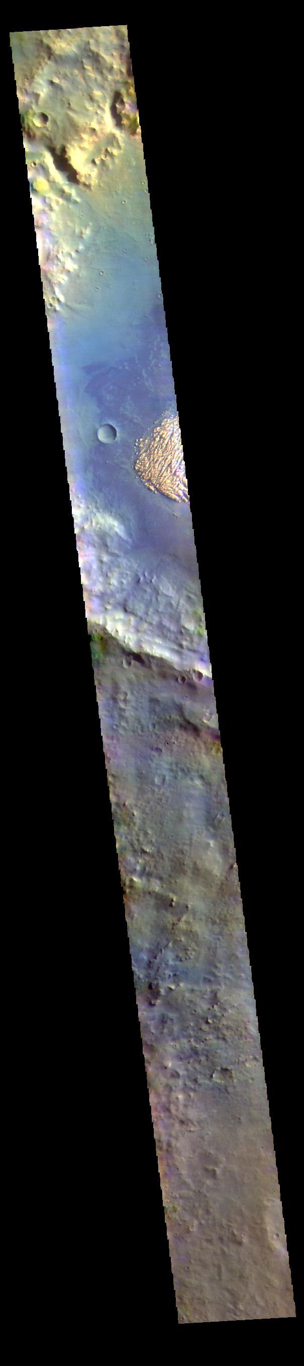 This VIS image shows part of the floor of Pollack Crater. First imaged by Mariner 9, the high contrast between the crater floor and the bright feature, led to the informal name "white rock" for the bright floor feature. More recent images have shown that the floor of Pollack Crater is darker then normal in that part of the crater, which has produced the high contrast. THEMIS IR images of the feature indicate a composition produced by wind deposition, rather than water. Additionally, the deposit does not appear to be solid rock. The deposit is most likely a combination of dust and a more solid material. Taken together, the Mariner 9 image of white rock didn't hold up under careful study, it's not white and it's not rock!  The THEMIS VIS camera contains 5 filters. The data from different filters can be combined in multiple ways to create a false color image. These false color images may reveal subtle variations of the surface not easily identified in a single band image.  Orbit Number: 62872 Latitude: -8.53297 Longitude: 24.916 Instrument: VIS Captured: 2016-02-15 15:52  https://photojournal.jpl.nasa.gov/catalog/PIA23114