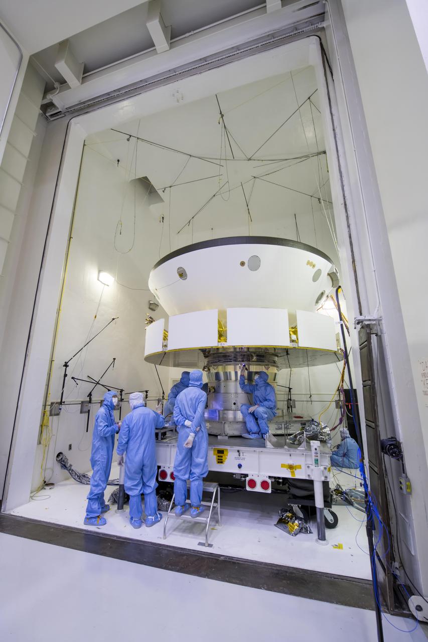 Engineers and technicians working on NASA's Mars 2020 mission prepare spacecraft components for acoustic testing in the Environmental Test Facility at NASA's Jet Propulsion Laboratory in Pasadena, California. The spacecraft is being tested in the same configuration it will be in when sitting atop the Atlas rocket that will launch the latest rover towards Mars in July 2020.  The image was taken on April 11, 2019, at JPL.  https://photojournal.jpl.nasa.gov/catalog/PIA23160