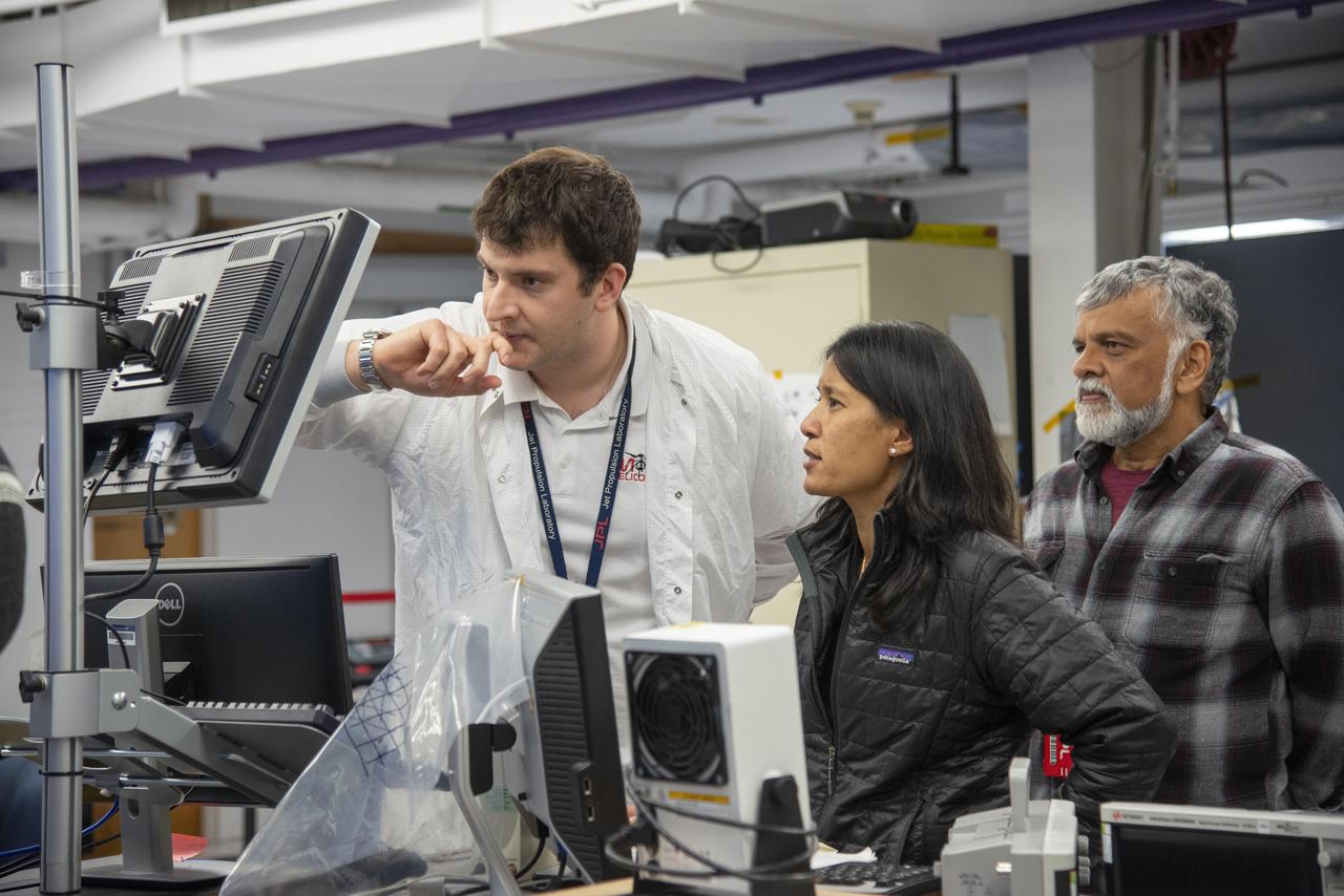 Teddy Tzanetos, MiMi Aung and Bob Balaram of NASA's Mars Helicopter project observe a flight test. The image was taken on Jan. 18, 2019 as the flight model of the Mars Helicopter was tested in the Space Simulator, a 25-foot-wide (7.62 meter-wide) vacuum chamber at NASA's Jet Propulsion Laboratory in Pasadena, California.  https://photojournal.jpl.nasa.gov/catalog/PIA23161