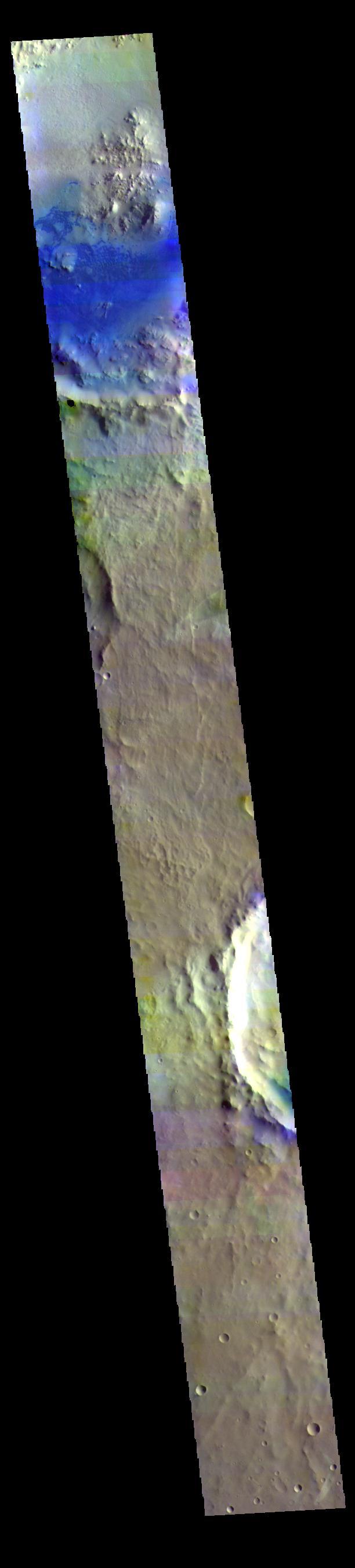 Today's false color image shows part of Arabia Terra. Dark blue tones in false color indicate basaltic sands, which can be seen in the unnamed crater at the top of the image.  The THEMIS VIS camera contains 5 filters. The data from different filters can be combined in multiple ways to create a false color image. These false color images may reveal subtle variations of the surface not easily identified in a single band image.  Orbit Number: 63122 Latitude: 8.6734 Longitude: 8.32956 Instrument: VIS Captured: 2016-03-07 06:08  https://photojournal.jpl.nasa.gov/catalog/PIA23218