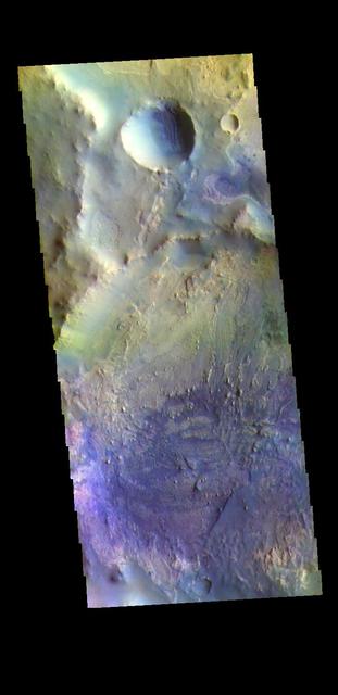 Today's false color image shows part of an unnamed crater in Arabia Terra. The THEMIS VIS camera contains 5 filters. The data from different filters can be combined in multiple ways to create a false color image. These false color images may reveal subtle variations of the surface not easily identified in a single band image. Orbit Number: 63509 Latitude: 2.8368 Longitude: 1.12045 Instrument: VIS Captured: 2016-04-08 03:07 https://photojournal.jpl.nasa.gov/catalog/PIA23225