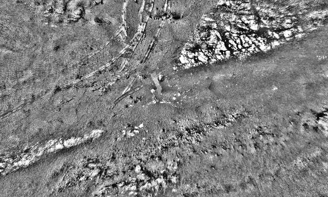 This mosaic was stitched together using images from the Navigation Camera, or Navcam, on NASA's Opportunity rover. The scene shows the rover's tracks made in Perseverance Valley between Sols 5,000 and 5,030.  The mosaic has a resolution of about 1 centimeter per pixel; the scene width is 66 feet (20 meters) while the scene height is 39 feet (12 meters). The rover wheel tracks are about 3 feet (1 meter) apart. Shading differences between frames have been adjusted so subtle surface details are more visible.  https://photojournal.jpl.nasa.gov/catalog/PIA23246