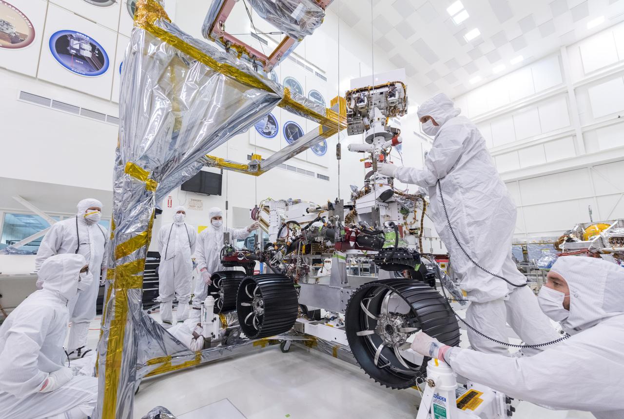 In this image, taken on June 13, 2019, engineers at JPL install the starboard legs and wheels — otherwise known as the mobility suspension — on the Mars 2020 rover.  https://photojournal.jpl.nasa.gov/catalog/PIA23269
