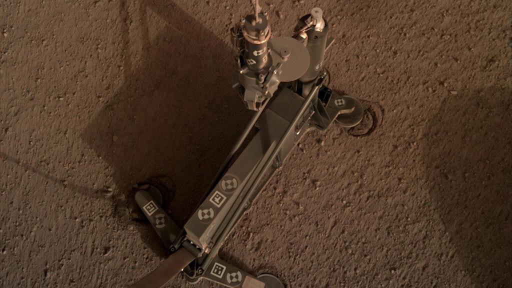 The support structure of the Heat Flow and Physical Properties Package (HP3) instrument moved slightly during hammering, as indicated by the circular "footprints" that can be seen around the instrument's footpads.  These marks indicate the instrument's self-hammering mole wasn't digging as expected. This image was taken on March 4, 2019 (the 94th Martian day, or sol, of the mission).   https://photojournal.jpl.nasa.gov/catalog/PIA23271