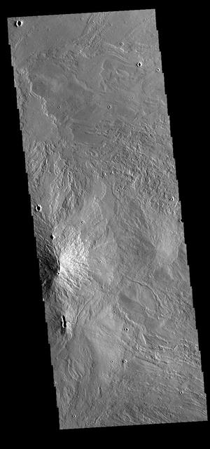 Today's VIS image shows part of the summit caldera of Arsia Mons. Arsia Mons is the southernmost of the three large Tharsis volcanoes. Extensive lava plains originated from eruptions of this volcano. On the left side of the image are two hills with linear depressions at the top. These features are vents where localized eruptions created small volcanoes.  Orbit Number: 77296 Latitude: -9.56554 Longitude: 239.266 Instrument: VIS Captured: 2019-05-18 20:32  https://photojournal.jpl.nasa.gov/catalog/PIA23281