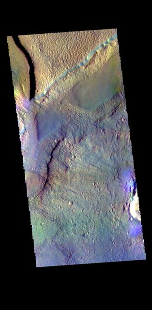 This false color image shows a graben located in Acidalia Planitia. Graben are depressions caused by movement of material downward between paired tectonic faults. The THEMIS VIS camera contains 5 filters. The data from different filters can be combined in multiple ways to create a false color image. These false color images may reveal subtle variations of the surface not easily identified in a single band image. Orbit Number: 63796 Latitude: 38.1105 Longitude: 353.781 Instrument: VIS Captured: 2016-05-01 18:39 https://photojournal.jpl.nasa.gov/catalog/PIA23290