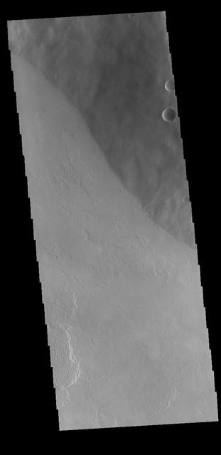 This VIS image is located on the flank of Tharsis Tholus. The Tharsis region of Mars is dominated by large volcanoes and extensive lava plains. Orbit Number: 77220 Latitude: 12.1833 Longitude: 269.178 Instrument: VIS Captured: 2019-05-12 14:27 https://photojournal.jpl.nasa.gov/catalog/PIA23299