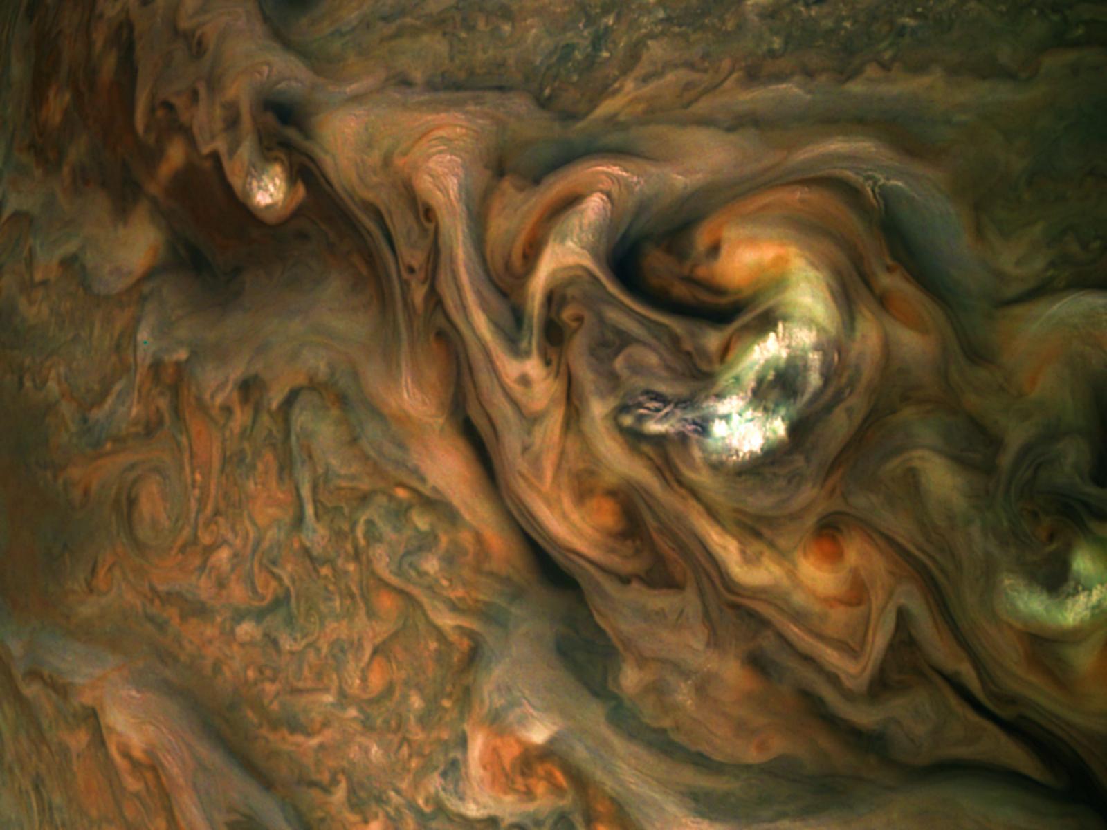 This view from NASA's Juno spacecraft captures colorful, intricate patterns in a jet stream region of Jupiter's northern hemisphere known as "Jet N3."