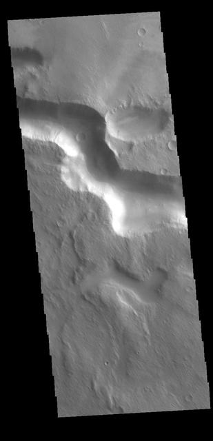 The channel in this VIS image is located on the western margin of Medusae Fossae.  Orbit Number: 78907 Latitude: -5.87425 Longitude: 198.259 Instrument: VIS Captured: 2019-09-28 12:25  https://photojournal.jpl.nasa.gov/catalog/PIA23522