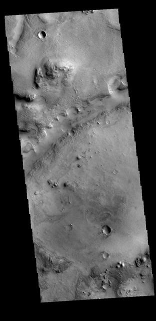 Today's VIS image shows one of the linear depressions that form Nili Fossae. Nili Fossae is a collection of curved faults and down-dropped blocks of crust between the faults called graben. The graben lie northeast of the large volcano Syrtis Major and northwest of the ancient impact basin Isidis Planitia. Orbit Number: 78911 Latitude: 22.6314 Longitude: 78.9859 Instrument: VIS Captured: 2019-09-28 20:29 https://photojournal.jpl.nasa.gov/catalog/PIA23524