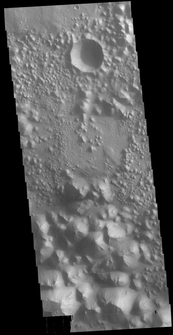 Today's VIS image shows a small section of Hydaspis Chaos, one of many regions of chaos in Margaritifer Terra. The term chaos is applied to regions where the surface is being eroded to form mesas. As the surface processes continue individual mesas become more isolated and take on the appearance of regions of hills. Hydaspis Chaos is is part of the huge outflow system flowing from Valles Marineris to Chryse Planitia. Orbit Number: 79027 Latitude: 2.3043 Longitude: 335.049 Instrument: VIS Captured: 2019-10-08 09:37 https://photojournal.jpl.nasa.gov/catalog/PIA23544