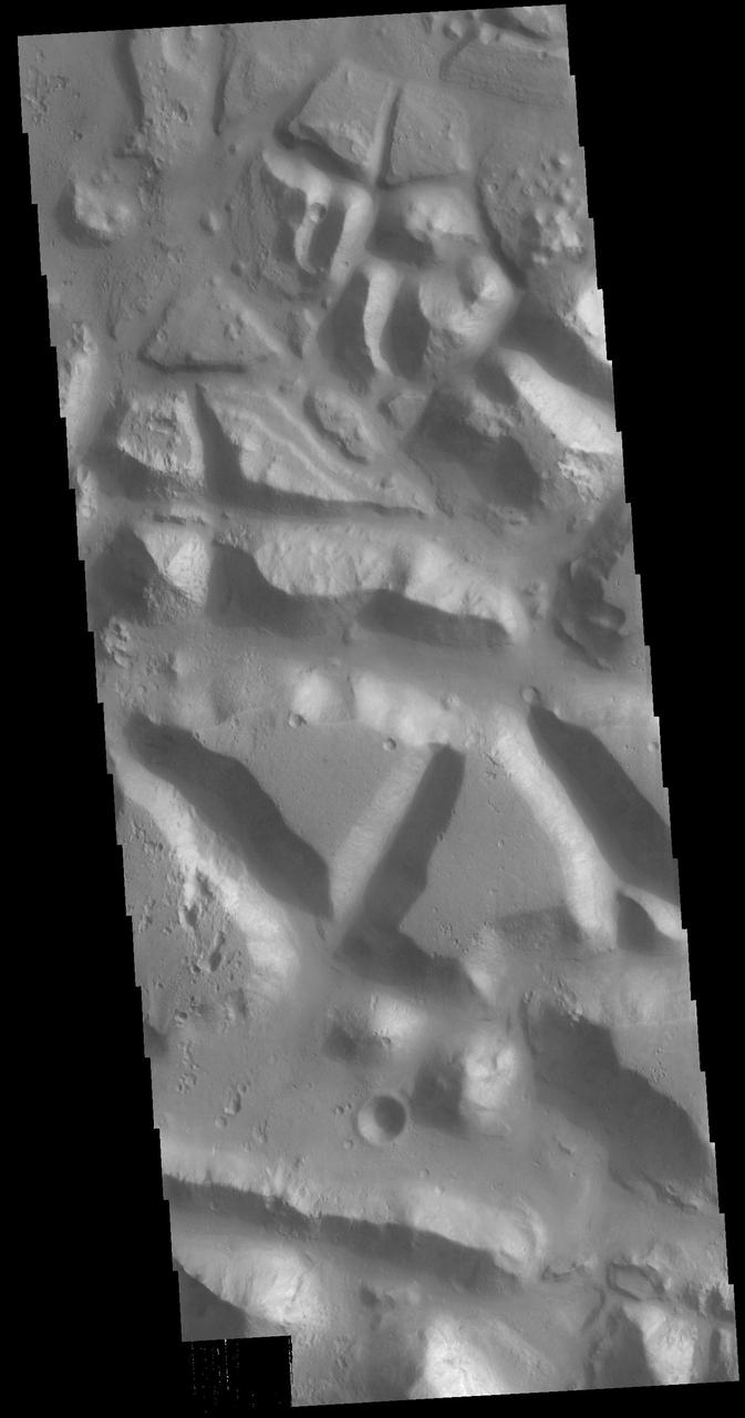 Huge regions of complex valleys and chaos are located in Xanthe and Margaritifer Terras. Rising from Valles Marineris, outflow channels like Ares, Tiu and Shalbantana valles empty into Chryse Planitia. This VIS image shows part of Chryse Chaos, located within Masursky Crater, along the Tiu Valles channel. Chaos forms from erosion of the surface into mesa features. With time the valleys expand creating the jumble of hills seen in the image. Orbit Number: 79152 Latitude: 11.5428 Longitude: 327.544 Instrument: VIS Captured: 2019-10-18 16:42 https://photojournal.jpl.nasa.gov/catalog/PIA23578