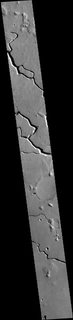 This VIS image is located in the central portion of Hephaestus Fossae. Hephaestus Fossae is a complex channel system in Utopia Planitia near Elysium Mons. It has been proposed that the channel formed by the release of melted subsurface ice during the impact event that created a large crater south of this image. Additionally, the nearby Elysium volcanic center created subsurface heating that may have played a part in creating both Hephaestus Fossae and Hebrus Valles to the north. Orbit Number: 79159 Latitude: 19.0493 Longitude: 124.534 Instrument: VIS Captured: 2019-10-19 06:34 https://photojournal.jpl.nasa.gov/catalog/PIA23579