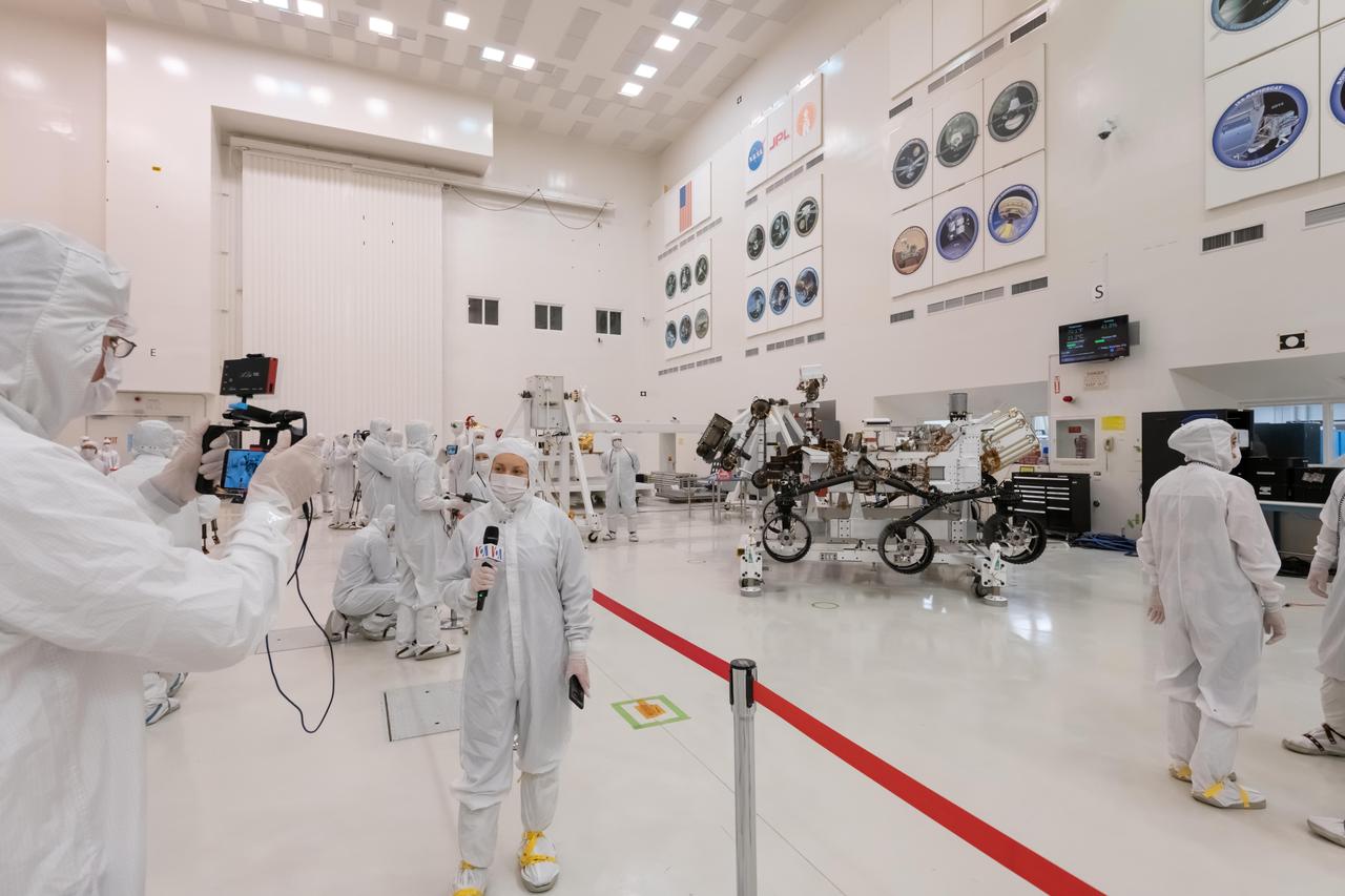 During their only opportunity to see NASA's next Mars rover from inside JPL's clean room prior to its shipment to Cape Canaveral, members of the media interview the builders of the Mars 2020 mission. The image was taken inside the clean room on Dec. 27, 2019.  https://photojournal.jpl.nasa.gov/catalog/PIA23586