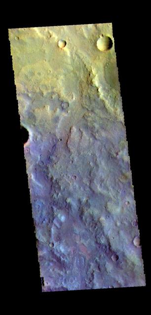This false color image shows part of Terra Cimmeria. The complexity of the surface is evident in the multiple colors seen in this image. The bright blue-white and lavender spots towards the bottom of the image stand out against the more usual blues and yellows. The THEMIS VIS camera contains 5 filters. The data from different filters can be combined in multiple ways to create a false color image. These false color images may reveal subtle variations of the surface not easily identified in a single band image. Orbit Number: 64802 Latitude: -9.56903 Longitude: 127.898 Instrument: VIS Captured: 2016-07-23 15:06 https://photojournal.jpl.nasa.gov/catalog/PIA23613