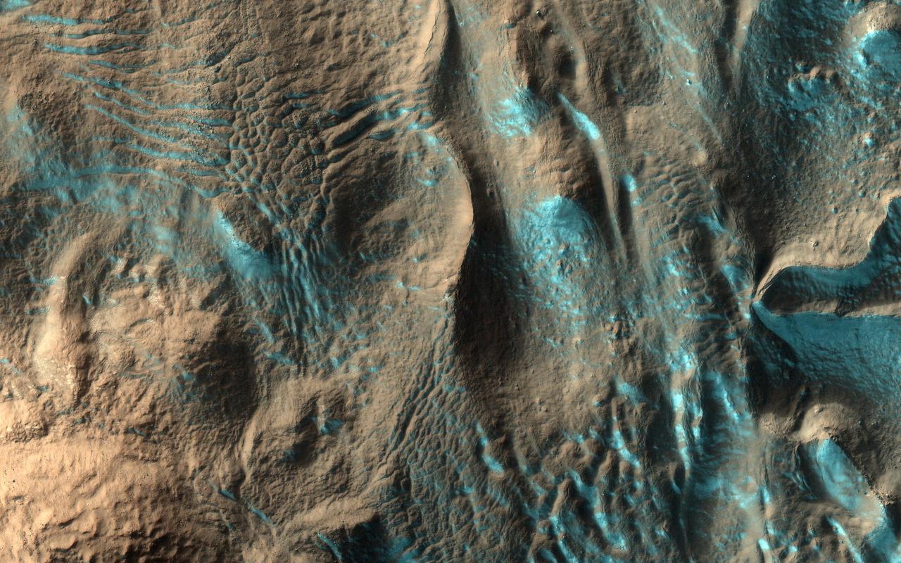 When we acquired this image, it was northern summer and southern winter on Mars, but signs of spring are already starting to appear at latitudes not far from the equator. This image of Penticton Crater, taken at latitude 38 degrees south, shows streamers of seasonal carbon dioxide ice (dry ice) only remaining in places in the terrain that are still partially in the shade. The turquoise-colored frost (enhanced color) is protected from the sun in shadowed dips in the ground while the sunlit surface nearby is already frost-free. https://photojournal.jpl.nasa.gov/catalog/PIA23667