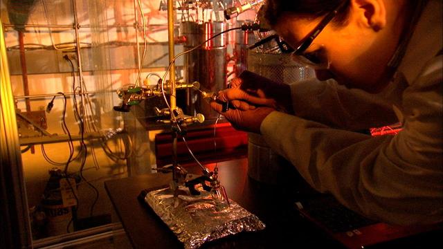 Lauren White, a scientist at NASA's Jet Propulsion Laboratory, adjusts an experiment that simulates how ancient seawater and fluid from hydrothermal vents could have reacted with minerals from the seafloor to create organic molecules 4.5 billion years ago. The image was taken at JPL in 2014.  https://photojournal.jpl.nasa.gov/catalog/PIA23688